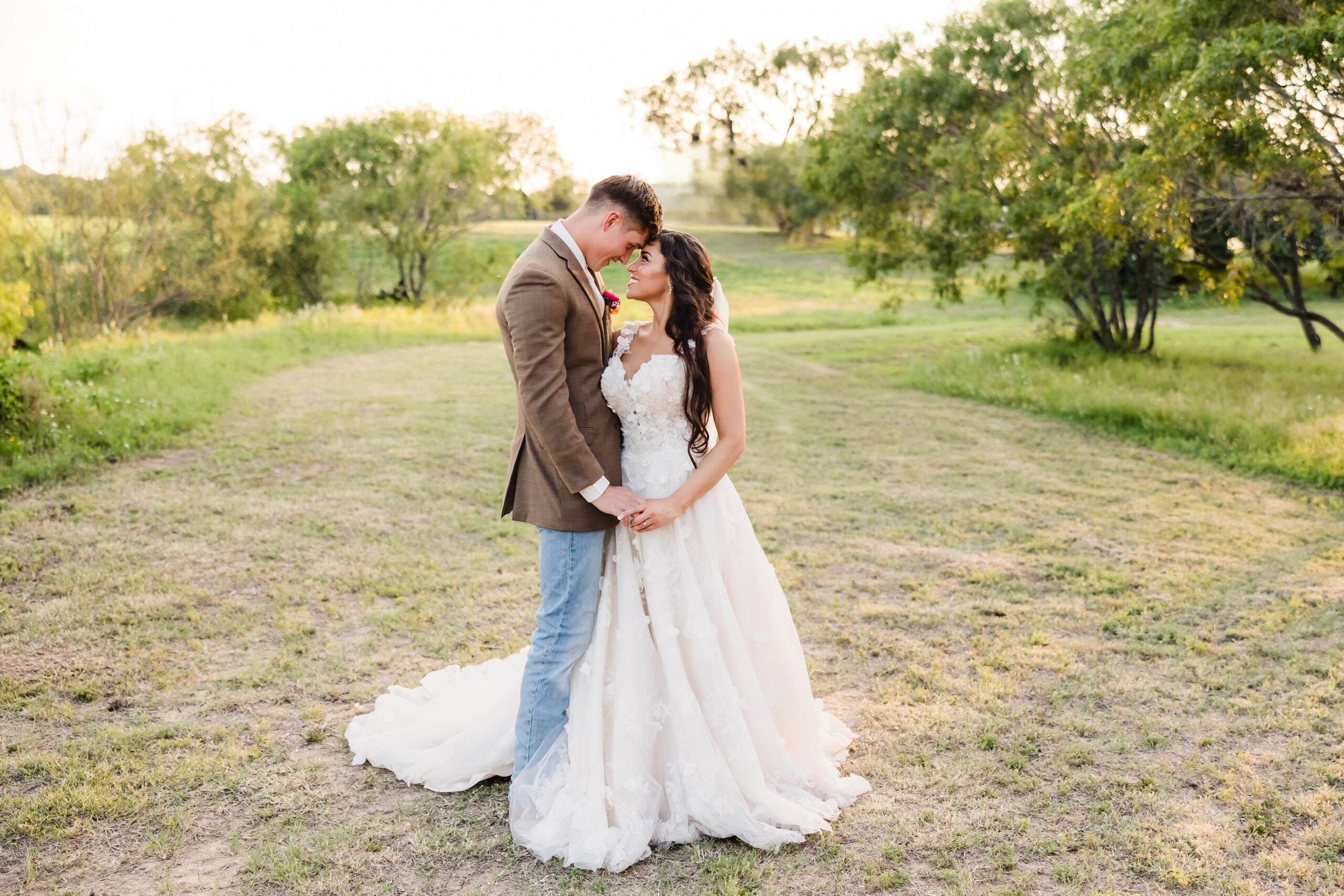 Newlyweds in a field at Grandview Weddings and Events